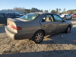 1999 Toyota Camry LE z VIN JT2BF22K0X0167589, wystawiony jako Copart lot #42699015 z przebiegiem 198 634 mil mil oraz Czysty tytuł • Clean title. Historia ofert i sprzedaży dostępna na DreamBid. Obrazek 3.