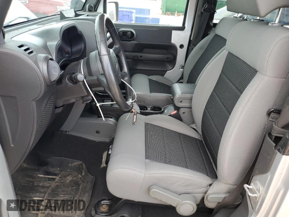 2009 Jeep Wrangler X with VIN 1J4FA24199L787574, listed as a Copart auction lot 58189835 with 74,331 mi miles and Salvage title. Bid and sale history available at DreamBid. Image 7.