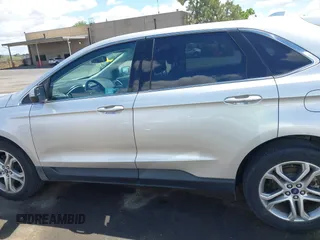 2015 Ford Edge Titanium z VIN 2FMTK4K95FBB47962, wystawiony jako IAAI lot #42234894 z przebiegiem Nie podano mil oraz . Historia ofert i sprzedaży dostępna na DreamBid. Obrazek 14.