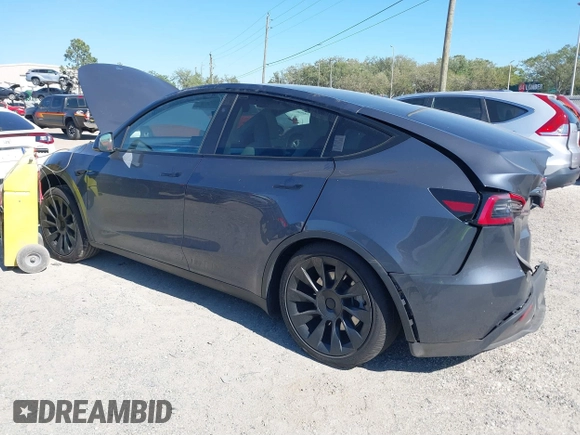 2023 Tesla Model Y Long Range with VIN 7SAYGDEE1PA203937, listed as a IAAI auction lot 41814421 with 9,138 mi miles. Bid and sale history available at carsss.com. Image 3.