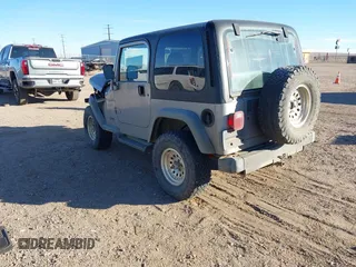 2001 Jeep Wrangler Sport with VIN 1J4FA49S91P324912, listed as a IAAI auction lot 41261214 with 260,299 mi miles. Bid and sale history available at carsss.com. Image 3.