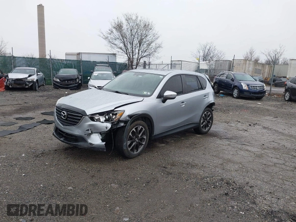2016 Mazda CX-5 Grand Touring with VIN JM3KE4DY4G0712465, listed as a IAAI auction lot 41859217 with 61,806 mi miles and . Bid and sale history available at carsss.com. Image 18.