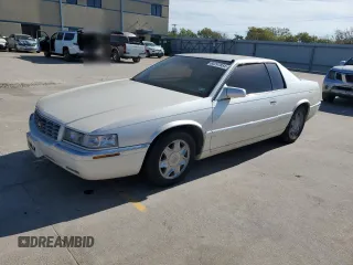 2000 Cadillac Eldorado z VIN 1G6EL12Y0YB702117, wystawiony jako Copart lot #80297854 z przebiegiem 124 851 mil mil oraz Szkoda całkowita • Salvage title. Historia ofert i sprzedaży dostępna na DreamBid. Obrazek 1.