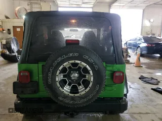 2002 Jeep Wrangler Sport with VIN 1J4FA49S72P701075, listed as a Copart auction lot 66894914 with 169,971 mi miles and Salvage Title. Bid and sale history available at carsss.com. Image 6.