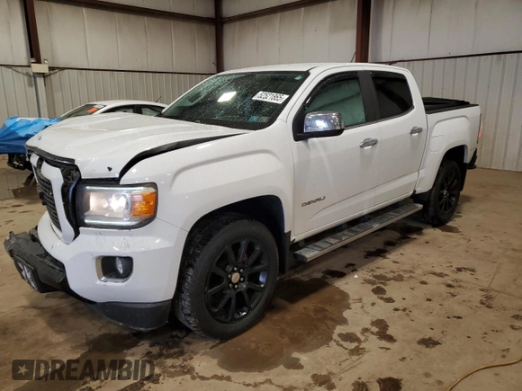 2018 GMC Canyon 4WD Denali z VIN 1GTG6EEN6J1171037, wystawiony jako Copart lot #52521865 z przebiegiem 99 931 mil mil oraz Szkoda całkowita • Salvage title. Historia ofert i sprzedaży dostępna na DreamBid. Obrazek 1.