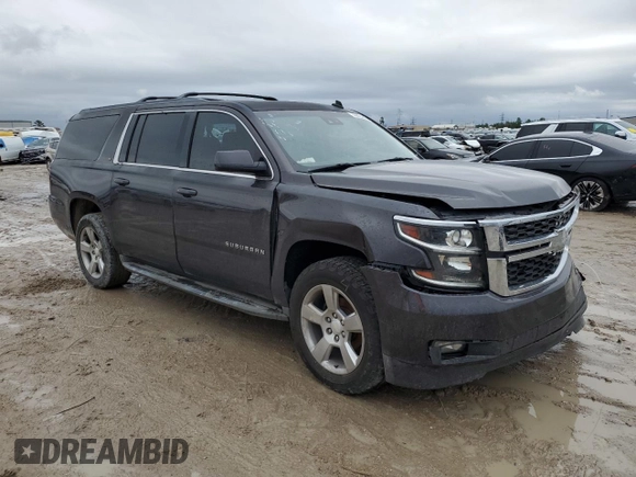 2015 Chevrolet Suburban LT with VIN 1GNSCJKC1FR159411, listed as a Copart auction lot 52169465 with 145,511 mi miles and Salvage title. Bid and sale history available at DreamBid. Image 4.