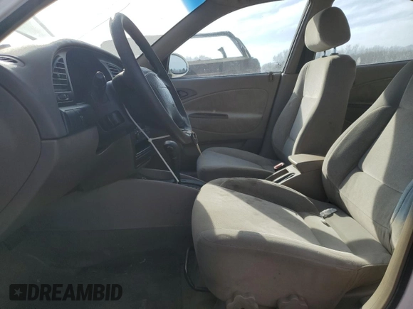 2001 Daewoo Nubira z VIN KLAJC52Z01K711120, wystawiony jako Copart lot #48926575 z przebiegiem 103 375 mil mil oraz Tytuł czysty. Historia ofert i sprzedaży dostępna na DreamBid. Obrazek 7.