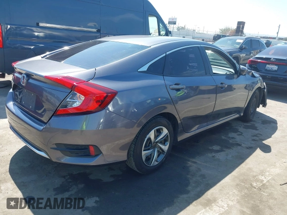 2020 Honda Civic LX with VIN 2HGFC2F67LH551651, listed as a IAAI auction lot 41861966 with 205,619 mi miles and . Bid and sale history available at DreamBid. Image 4.