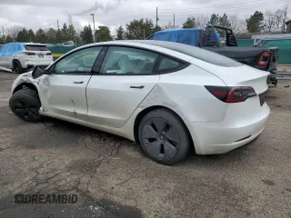2023 Tesla Model 3 with VIN 5YJ3E1EAXPF600008, listed as a Copart auction lot 51868055 with 58,733 mi miles and Salvage title. Bid and sale history available at DreamBid. Image 2.