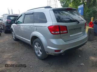 2012 Dodge Journey SXT with VIN 3C4PDDBG1CT323727, listed as a IAAI auction lot 42473238 with 77,035 mi miles and . Bid and sale history available at DreamBid. Image 3.