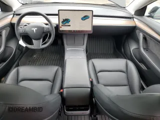 2023 Tesla Model 3 with VIN 5YJ3E1EA9PF687187, listed as a Copart auction lot 61044055 with 7,007 mi miles and Salvage title. Bid and sale history available at DreamBid. Image 8.