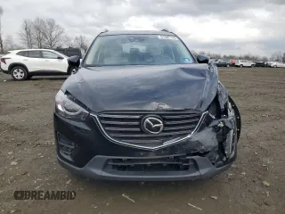 2016 Mazda CX-5 Grand Touring with VIN JM3KE4DY0G0727366, listed as a Copart auction lot 51682115 with 114,462 mi miles and Salvage Title. Bid and sale history available at carsss.com. Image 5.
