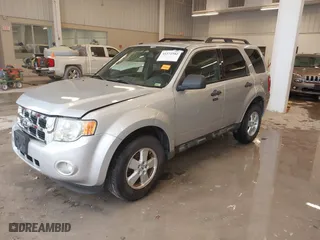 2010 Ford Escape XLT with VIN 1FMCU0D70AKB09942, listed as a IAAI auction lot 41572582 with 218,296 mi miles. Bid and sale history available at carsss.com. Image 2.