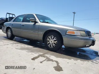 2003 Ford Crown Victoria LX z VIN 2FAFP74W43X123583, wystawiony jako Copart lot #57677555 z przebiegiem 185 336 mil mil oraz Szkoda całkowita • Salvage title. Historia ofert i sprzedaży dostępna na DreamBid. Obrazek 4.