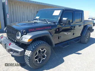 2023 Jeep Gladiator Rubicon z VIN 1C6JJTBG3PL531982, wystawiony jako IAAI lot #42211139 z przebiegiem 28 301 mil mil oraz . Historia ofert i sprzedaży dostępna na DreamBid. Obrazek 2.