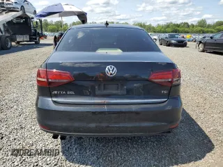 2017 Volkswagen Jetta SEL z VIN 3VWL17AJ6HM404789, wystawiony jako Copart lot #59029645 z przebiegiem 129 788 mil mil oraz Szkoda całkowita • Salvage title. Historia ofert i sprzedaży dostępna na DreamBid. Obrazek 6.