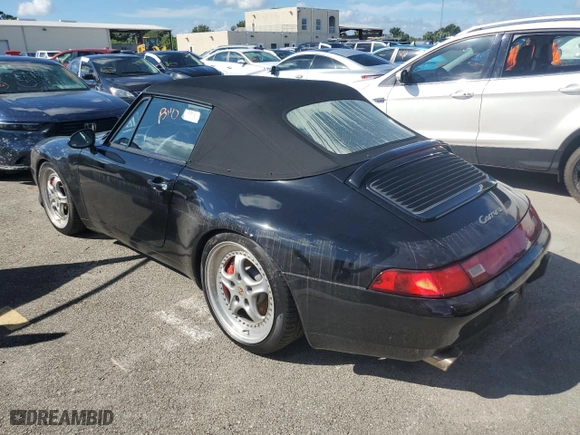1995 Porsche 911 Carrera with VIN WP0CA2998SS341094, listed as a Copart auction lot 74342534 with 49,930 mi miles and Salvage Title. Bid and sale history available at carsss.com. Image 2.