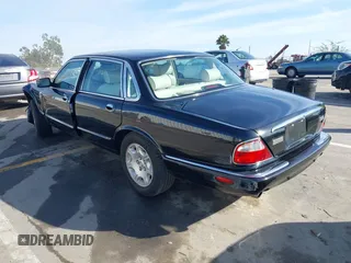 2003 Jaguar XJ 8 with VIN SAJDA14C03LF58706, listed as a IAAI auction lot 41619740 with 95,293 mi miles and . Bid and sale history available at DreamBid. Image 3.