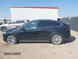 2019 Tesla Model X 75D with VIN 5YJXCBE22KF184504, listed as a IAAI auction lot 41802023 with 137,094 mi miles. Bid and sale history available at carsss.com. Image 14.
