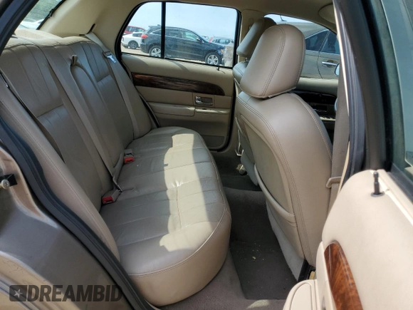 2005 Mercury Grand Marquis LS Premium z VIN 2MEFM75W65X609038, wystawiony jako Copart lot #55766005 z przebiegiem 132 136 mil mil oraz Szkoda całkowita • Salvage title. Historia ofert i sprzedaży dostępna na DreamBid. Obrazek 10.