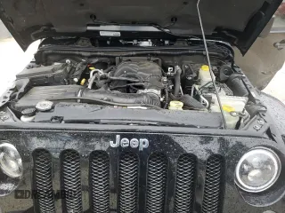 2014 Jeep Wrangler Unlimited Sahara z VIN 1C4HJWEG4EL305998, wystawiony jako Copart lot #56377275 z przebiegiem 60 597 mil mil oraz Szkoda całkowita • Salvage title. Historia ofert i sprzedaży dostępna na DreamBid. Obrazek 12.