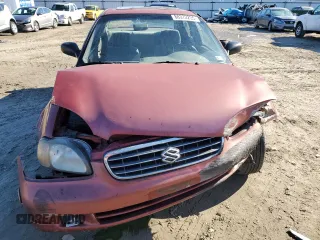 2001 Suzuki Esteem GL z VIN JS2GB41S915202412, wystawiony jako Copart lot #88372235 z przebiegiem 301 061 mil mil oraz Szkoda całkowita • Salvage title. Historia ofert i sprzedaży dostępna na DreamBid. Obrazek 5.