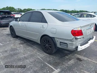 2005 Toyota Camry LE with VIN 4T1BE30K35U572110, listed as a IAAI auction lot 42674324 with 147,480 mi miles and . Bid and sale history available at DreamBid. Image 3.