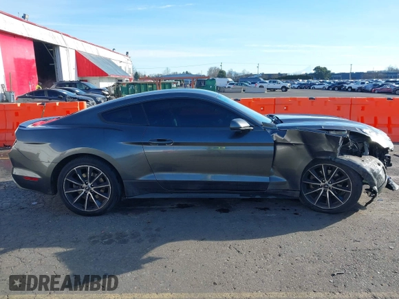 2015 Ford Mustang EcoBoost z VIN 1FA6P8TH7F5351477, wystawiony jako IAAI lot #41378347 z przebiegiem 104 755 mil mil oraz . Historia ofert i sprzedaży dostępna na DreamBid. Obrazek 13.