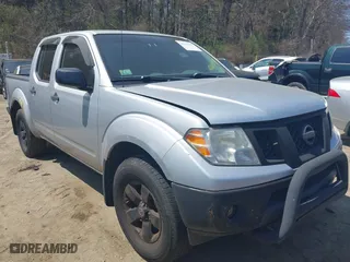 2011 Nissan Frontier PRO-4X with VIN 1N6AD0EVXBC407089, listed as a IAAI auction lot 42113537 with 124,853 mi miles. Bid and sale history available at carsss.com. Image 1.