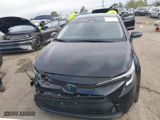 2024 Toyota Corolla Hybrid LE with VIN JTDBCMFE7R3034801, listed as a IAAI auction lot 41773438 with 42,440 mi miles. Bid and sale history available at carsss.com. Image 12.