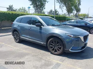 2022 Mazda CX-9 Grand Touring with VIN JM3TCBDY1N0611766, listed as a IAAI auction lot 42452059 with 60,755 mi miles and . Bid and sale history available at DreamBid. Image 1.