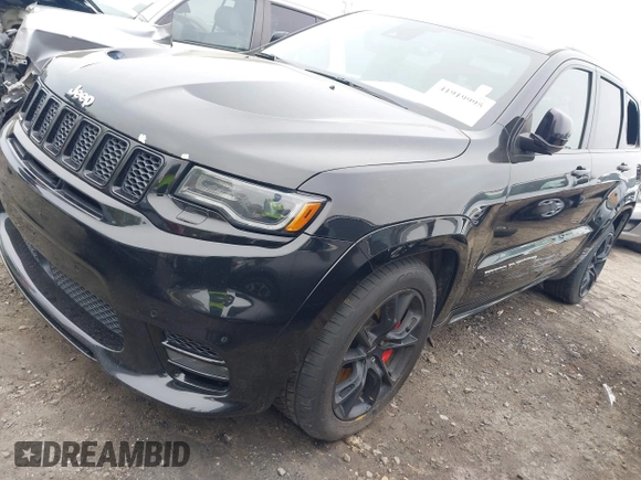 2017 Jeep Grand Cherokee SRT z VIN 1C4RJFDJ7HC683240, wystawiony jako IAAI lot #41919995 z przebiegiem 122 030 mil mil oraz . Historia ofert i sprzedaży dostępna na DreamBid. Obrazek 22.