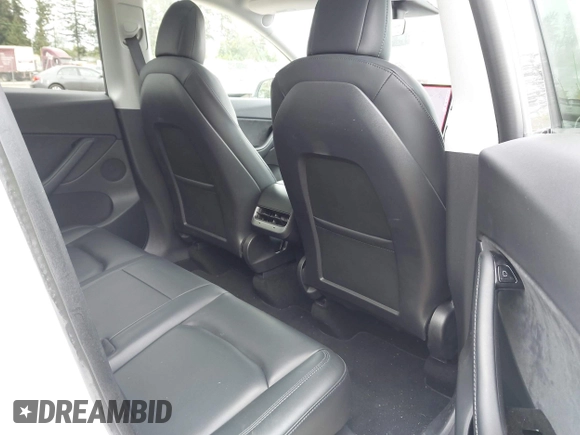 2021 Tesla Model Y Long Range with VIN 5YJYGDEE6MF082883, listed as a IAAI auction lot 42078807 with 64,953 mi miles. Bid and sale history available at carsss.com. Image 8.