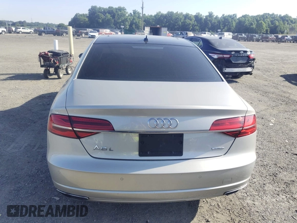 2017 Audi A8 with VIN WAU44AFD3HN014802, listed as a IAAI auction lot 42573537 with 121,096 mi miles and . Bid and sale history available at DreamBid. Image 16.