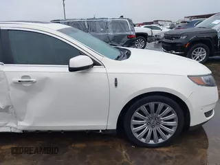 2013 Lincoln MKS with VIN 1LNHL9DK4DG605058, listed as a IAAI auction lot 41068489 with 101,801 mi miles. Bid and sale history available at carsss.com. Image 20.