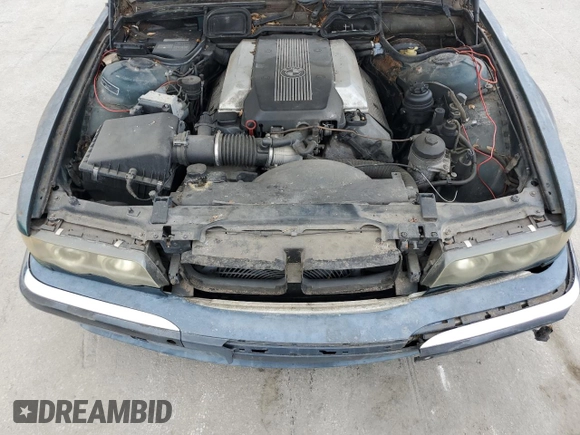 1996 BMW 7 Series 740iL z VIN WBAGJ8326TDL35670, wystawiony jako Copart lot #60806225 z przebiegiem 123 458 mil mil oraz Czysty tytuł • Clean title. Historia ofert i sprzedaży dostępna na DreamBid. Obrazek 11.