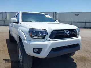 2014 Toyota Tacoma PreRunner z VIN 3TMJU4GN1EM159700, wystawiony jako IAAI lot #42460264 z przebiegiem 93 891 mil mil oraz . Historia ofert i sprzedaży dostępna na DreamBid. Obrazek 1.