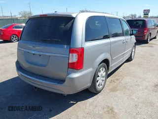 2016 Chrysler Town & Country Touring with VIN 2C4RC1BG7GR157863, listed as a IAAI auction lot 41849422 with 218,936 mi miles and . Bid and sale history available at DreamBid. Image 4.