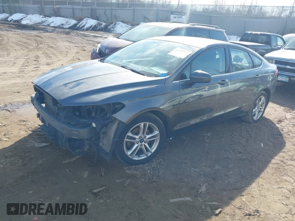 2018 Ford Fusion SE z VIN 3FA6P0HD7JR211569, wystawiony jako IAAI lot #41792146 z przebiegiem 187 505 mil mil oraz . Historia ofert i sprzedaży dostępna na DreamBid. Obrazek 2.