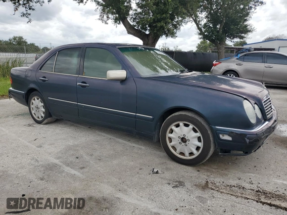 1997 Mercedes-Benz E-Class with VIN WDBJF55F4VJ025769, listed as a Copart auction lot 73460164 with 0 mi miles and Salvage Title. Bid and sale history available at carsss.com. Image 4.