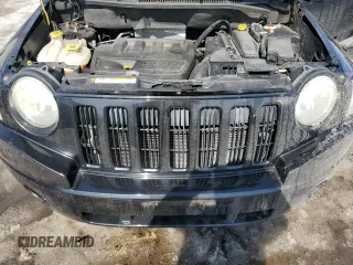 2010 Jeep Compass Sport with VIN 1J4NF4FB2AD591523, listed as a Copart auction lot 48809775 with 105,720 mi miles and Salvage Title. Bid and sale history available at carsss.com. Image 12.
