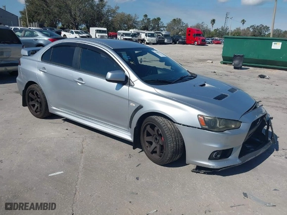 2013 Mitsubishi Lancer Evolution MR with VIN JA32W5FV6DU013470, listed as a IAAI auction lot 41544077 with 124262 miles. Bid and sale history available at carsss.com. Image 1.