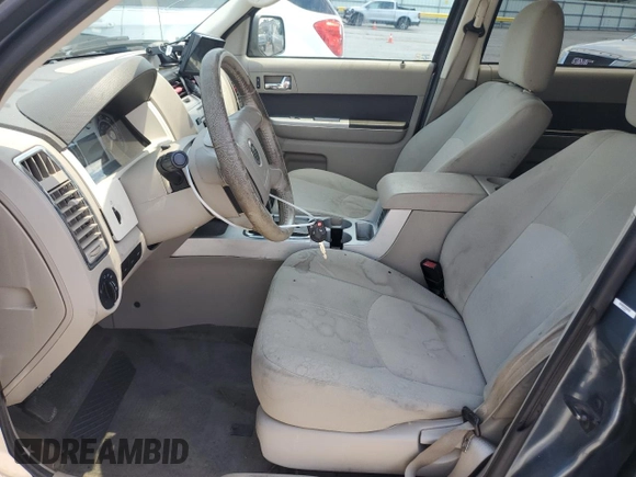 2010 Mercury Mariner with VIN 4M2CN9B70AKJ08597, listed as a Copart auction lot 63486595 with 113,207 mi miles and Salvage title. Bid and sale history available at DreamBid. Image 7.