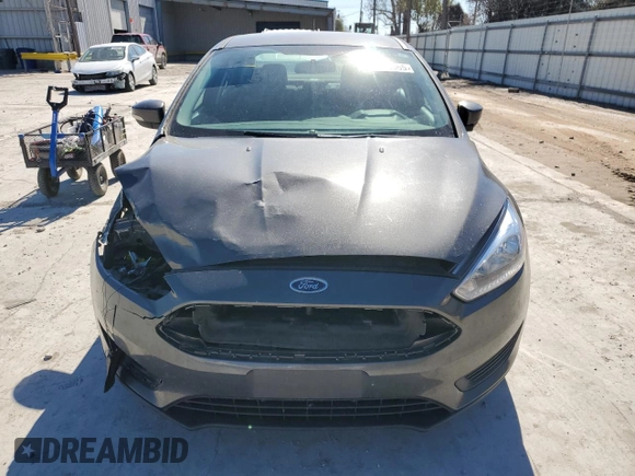 2015 Ford Focus SE с VIN 1FADP3F22FL299799, выставлен на аукционе Copart как лот 42420665 с пробегом 141 349 миль миль и Списание • Salvage title. История ставок и продаж доступна на DreamBid. Изображение 5.