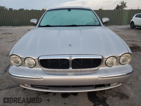 2004 Jaguar XJ with VIN SAJEA71C54SG01326, listed as a Copart auction lot 77449324 with 72,935 mi miles and Salvage Title. Bid and sale history available at carsss.com. Image 5.