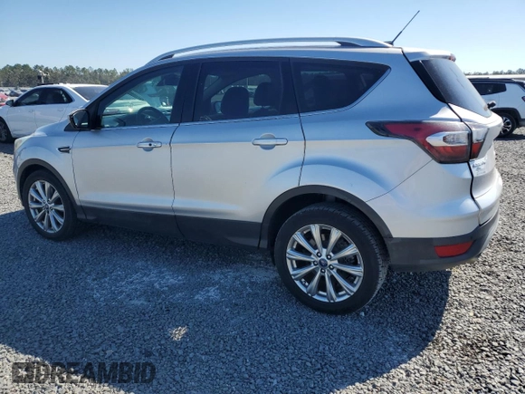 2017 Ford Escape Titanium with VIN 1FMCU0J90HUB04082, listed as a Copart auction lot 77814994 with 135,674 mi miles and Salvage Title. Bid and sale history available at carsss.com. Image 2.