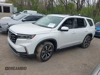 2023 Honda Pilot Elite with VIN 5FNYG1H80PB020937, listed as a IAAI auction lot 42024743 with 20,740 mi miles and . Bid and sale history available at DreamBid. Image 2.