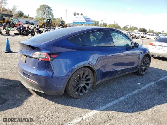 2023 Tesla Model Y Long Range with VIN 7SAYGDEEXPF814469, listed as a Copart auction lot 45982675 with 52,053 mi miles and Salvage Title. Bid and sale history available at carsss.com. Image 3.