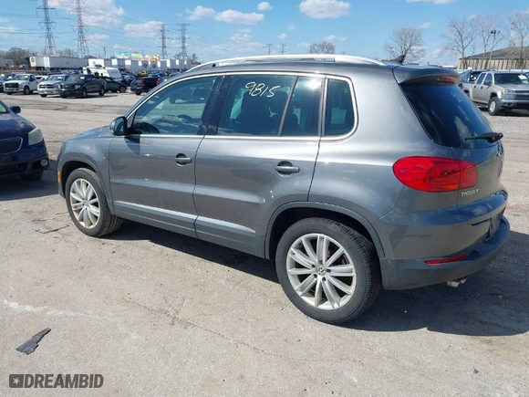 2012 Volkswagen Tiguan SE w/Sunroof & Nav with VIN WVGBV7AX4CW000207, listed as a IAAI auction lot 41889815 with 138,669 mi miles. Bid and sale history available at carsss.com. Image 3.