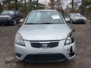2010 Kia Rio LX with VIN KNADH4A37A6645279, listed as a IAAI auction lot 40856780 with 165,385 mi miles. Bid and sale history available at carsss.com. Image 12.